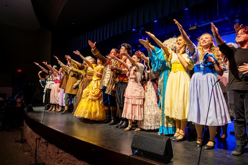 Actors perform onstage